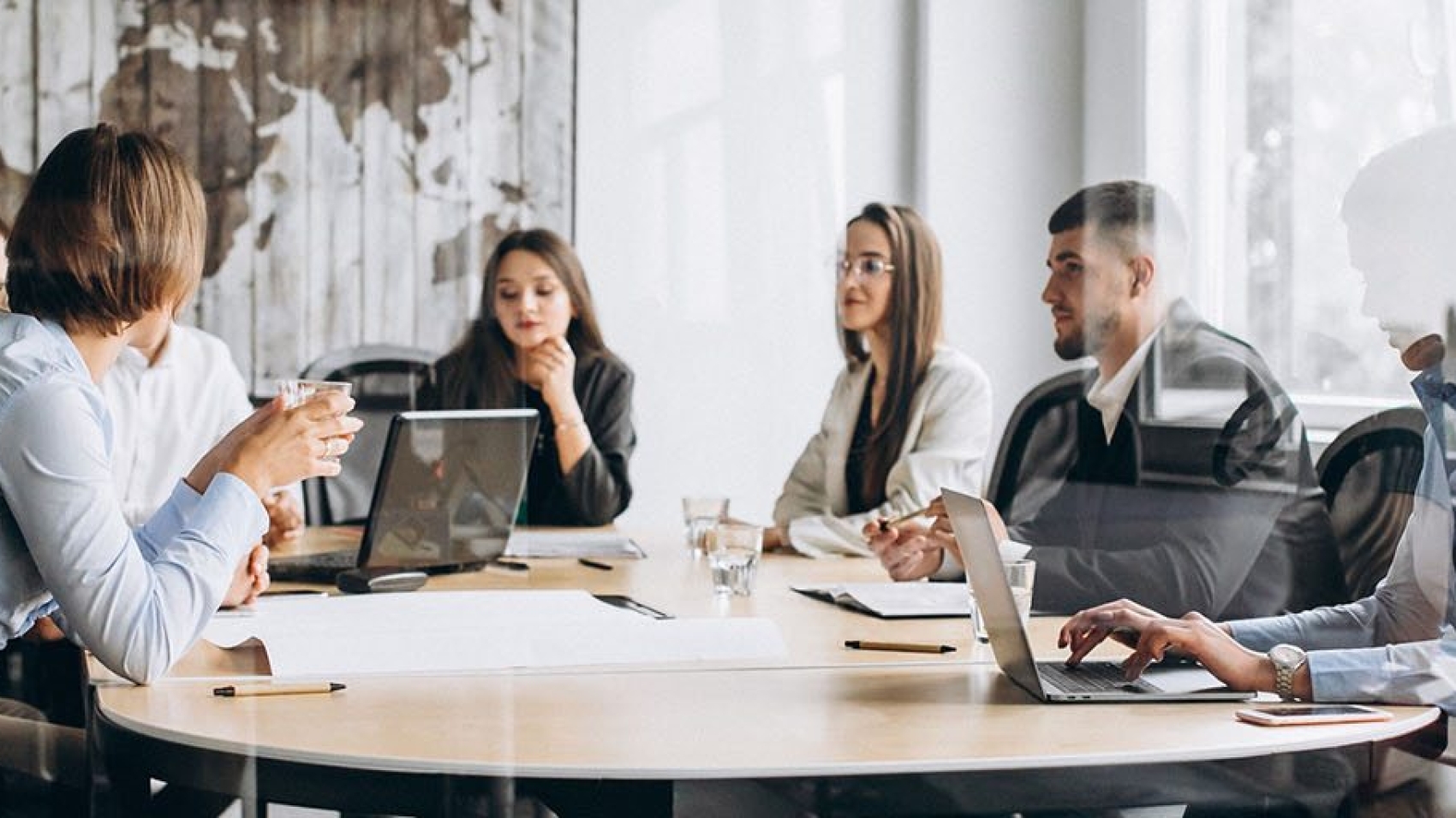 Group of people working out business plan in an office